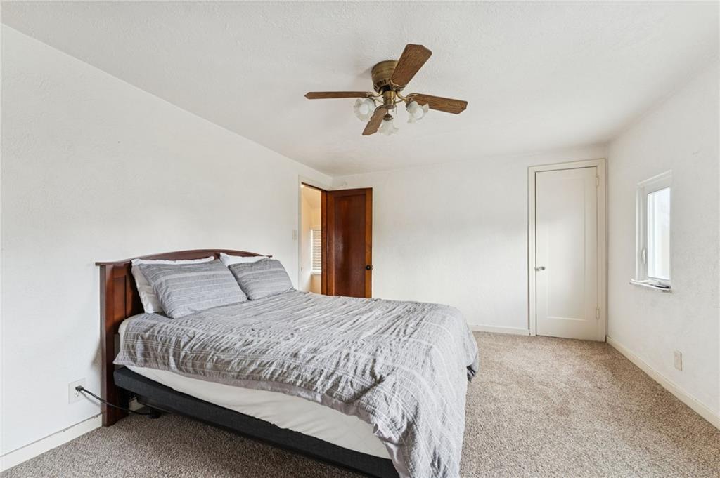 1200 Summerset Drive McKeesport, PA 15135 - Photo 15 of 27 a bedroom with a bed and painting on the wall