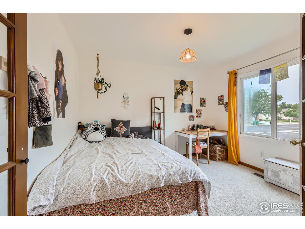 6301 Victoria Road Fort Collins, CO 80525 - Photo 14 of 16 a bedroom with bed and a large window