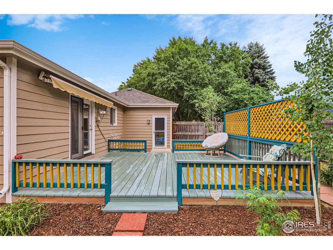 6301 Victoria Road Fort Collins, CO 80525 - Photo 15 of 16 a view of a house with a wooden fence