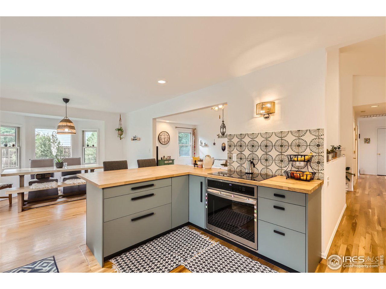 6301 Victoria Road Fort Collins, CO 80525 - Photo 4 of 16 a kitchen with a sink stove and cabinets