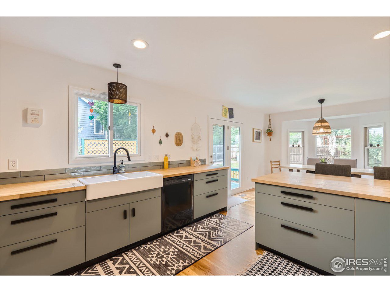 6301 Victoria Road Fort Collins, CO 80525 - Photo 5 of 16 a open kitchen with kitchen island a sink stainless steel appliances and cabinets
