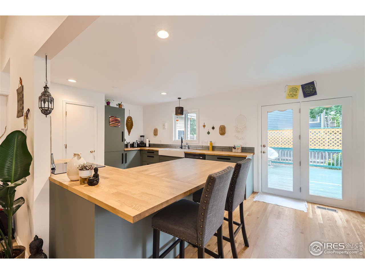 6301 Victoria Road Fort Collins, CO 80525 - Photo 6 of 16 a dining hall with stainless steel appliances kitchen island granite countertop a dining table chairs and a refrigerator