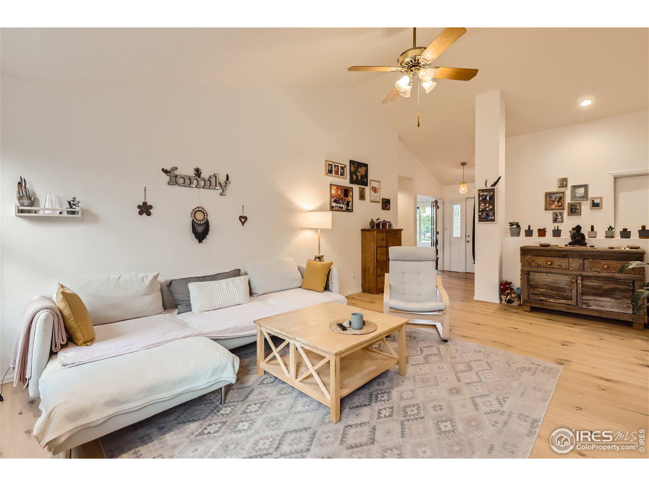 6301 Victoria Road Fort Collins, CO 80525 - Photo 8 of 16 a living room with furniture and a chandelier