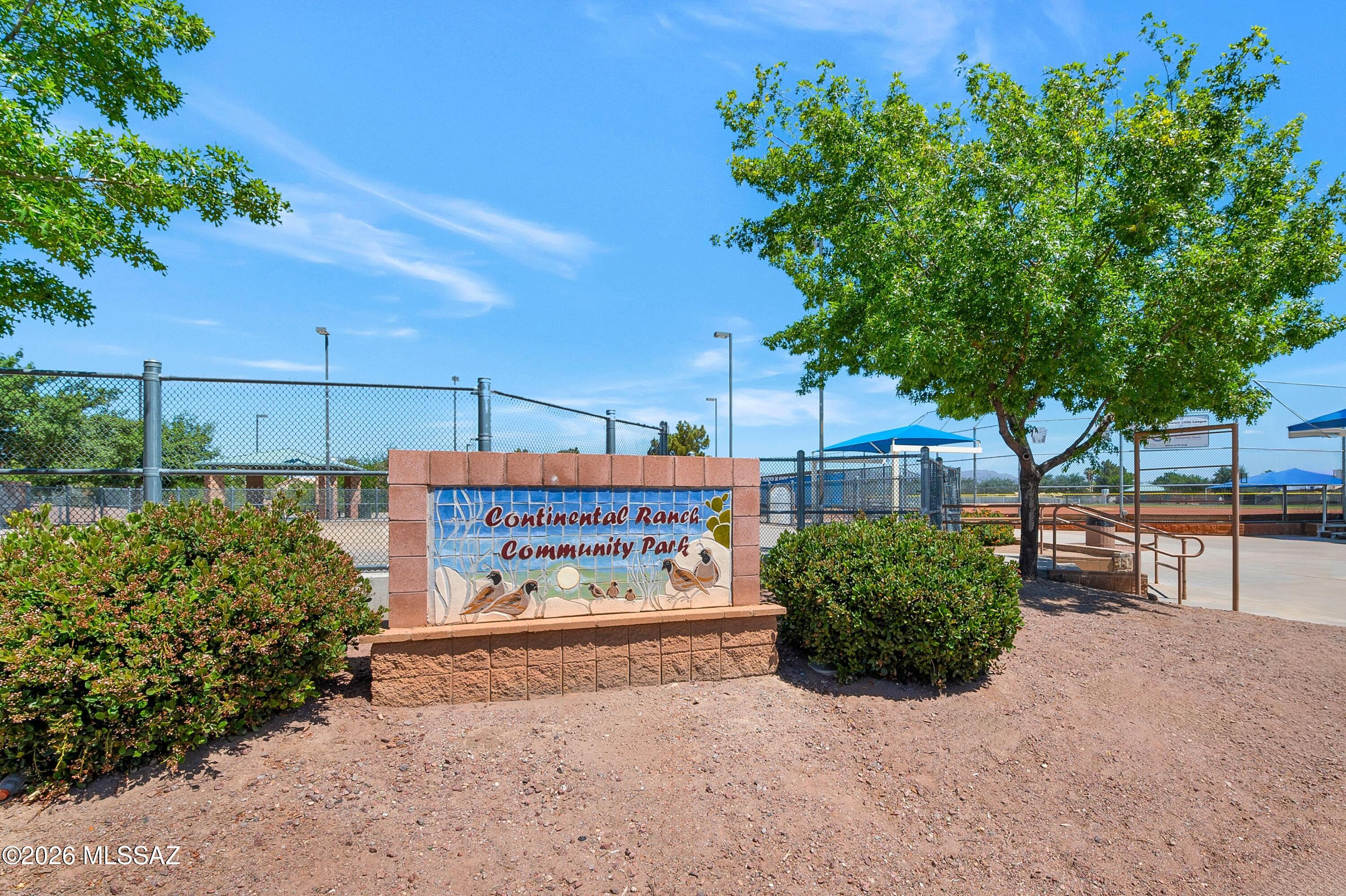 7159 West Maple Ridge Drive Tucson, AZ 85743 - Photo 36 of 42 a sign on the side of a road