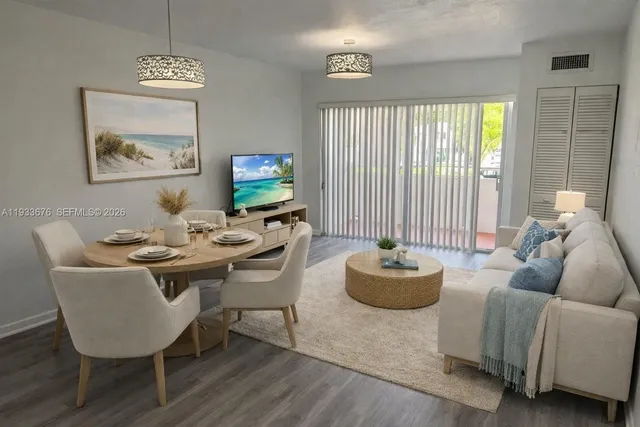 a living room with furniture and a large window