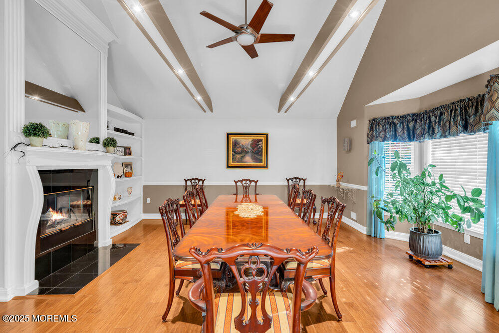117 South Cooks Bridge Road Jackson, NJ 08527 - Photo 13 of 48 a dining room with furniture potted plants and a fireplace