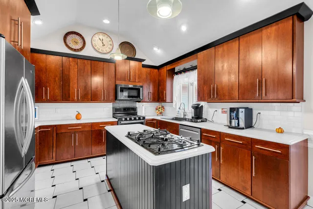 a kitchen with a sink stove and cabinets