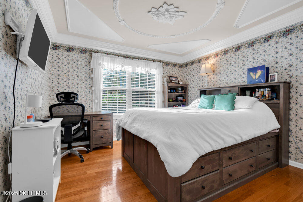 117 South Cooks Bridge Road Jackson, NJ 08527 - Photo 26 of 48 a bedroom with a bed and a flat tv screen on the dresser