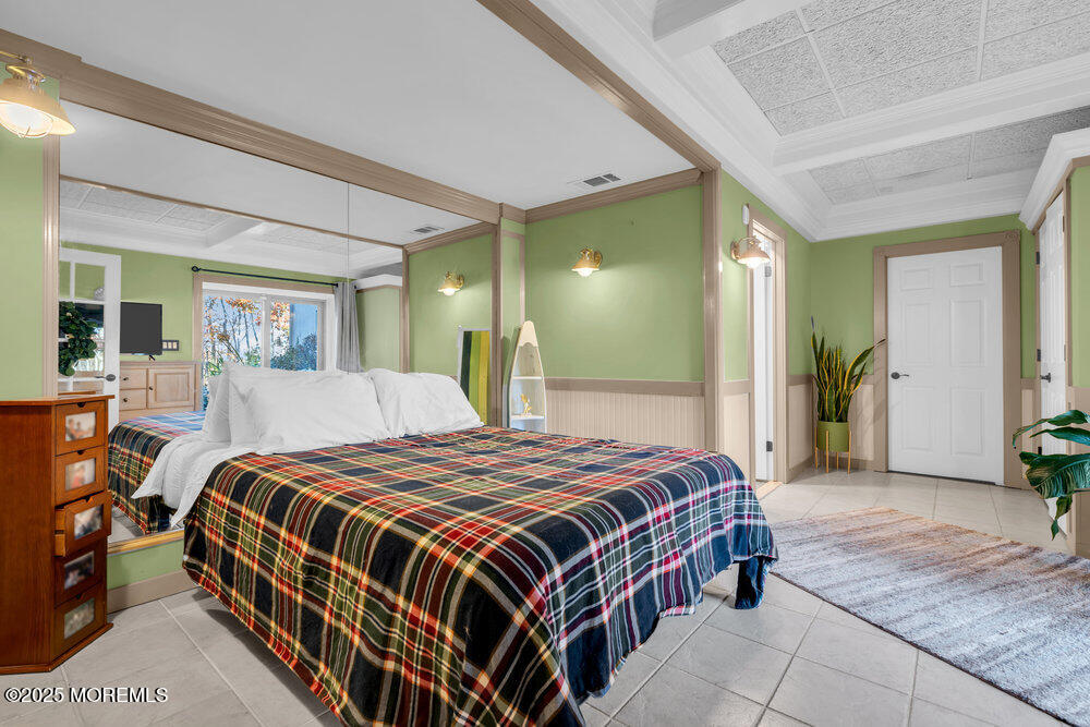 117 South Cooks Bridge Road Jackson, NJ 08527 - Photo 40 of 48 a spacious bedroom with a bed and a mirror