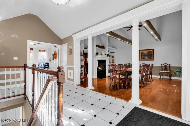 a view of a hallway with dining area