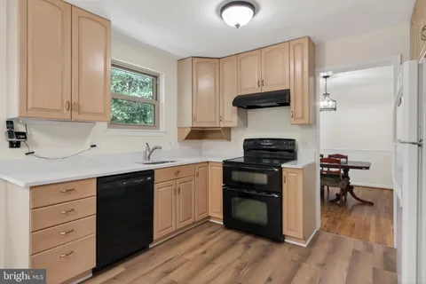 a kitchen with a stove and a sink