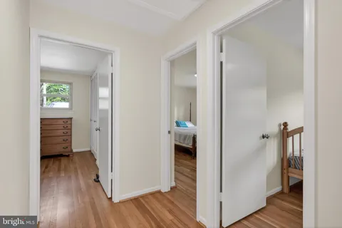a view of a bathroom with a sink and a mirror