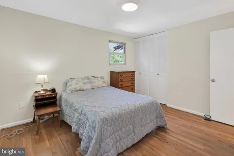 a bedroom with a bed and a table