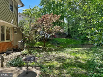 a backyard of a house with lots of green space