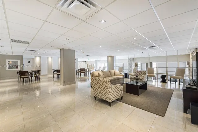 a living room with furniture and a table