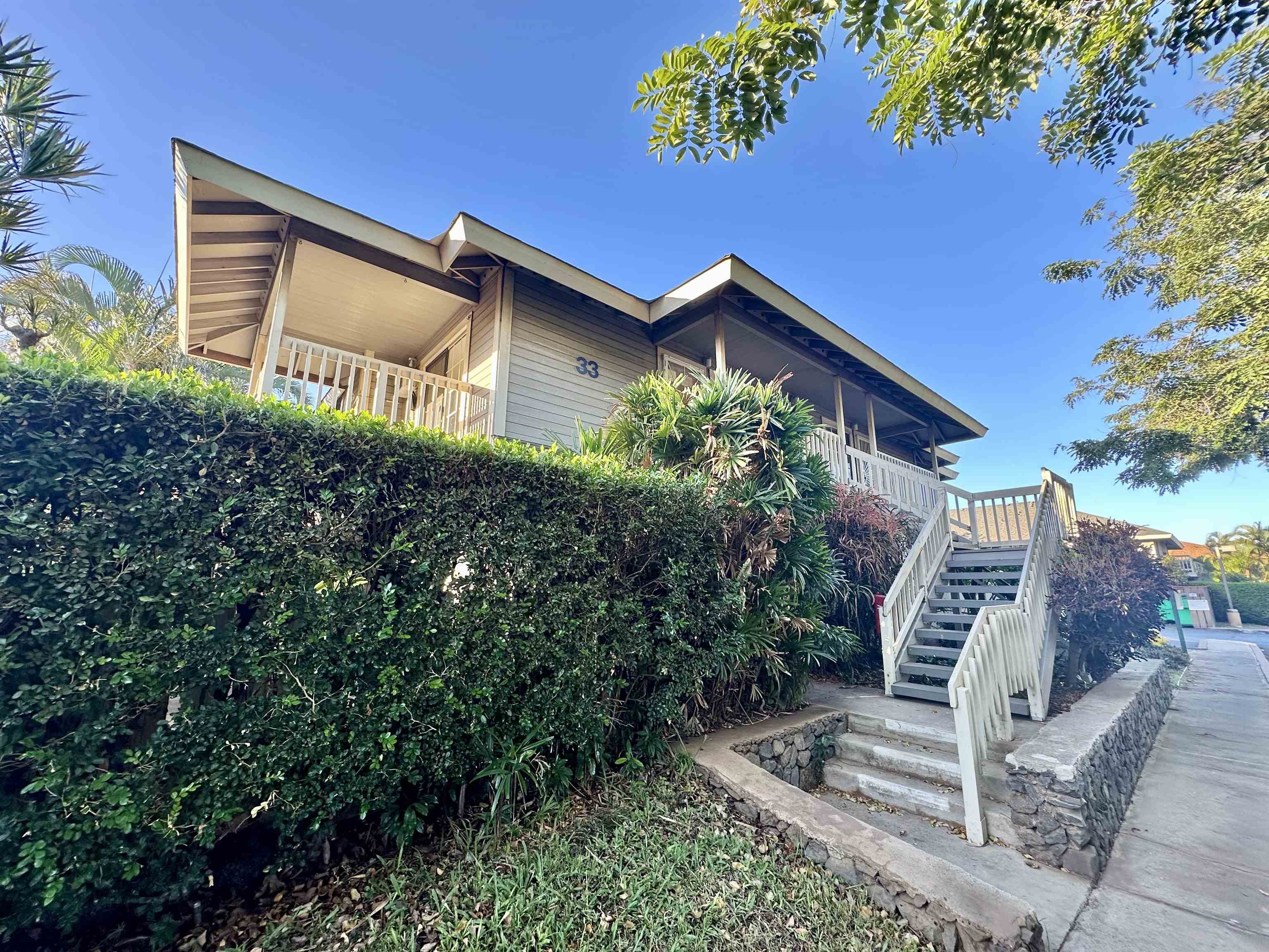 140 Uwapo Road, Unit 33201 Kihei, HI 96753 - Photo 11 of 13 a front view of a house with garden