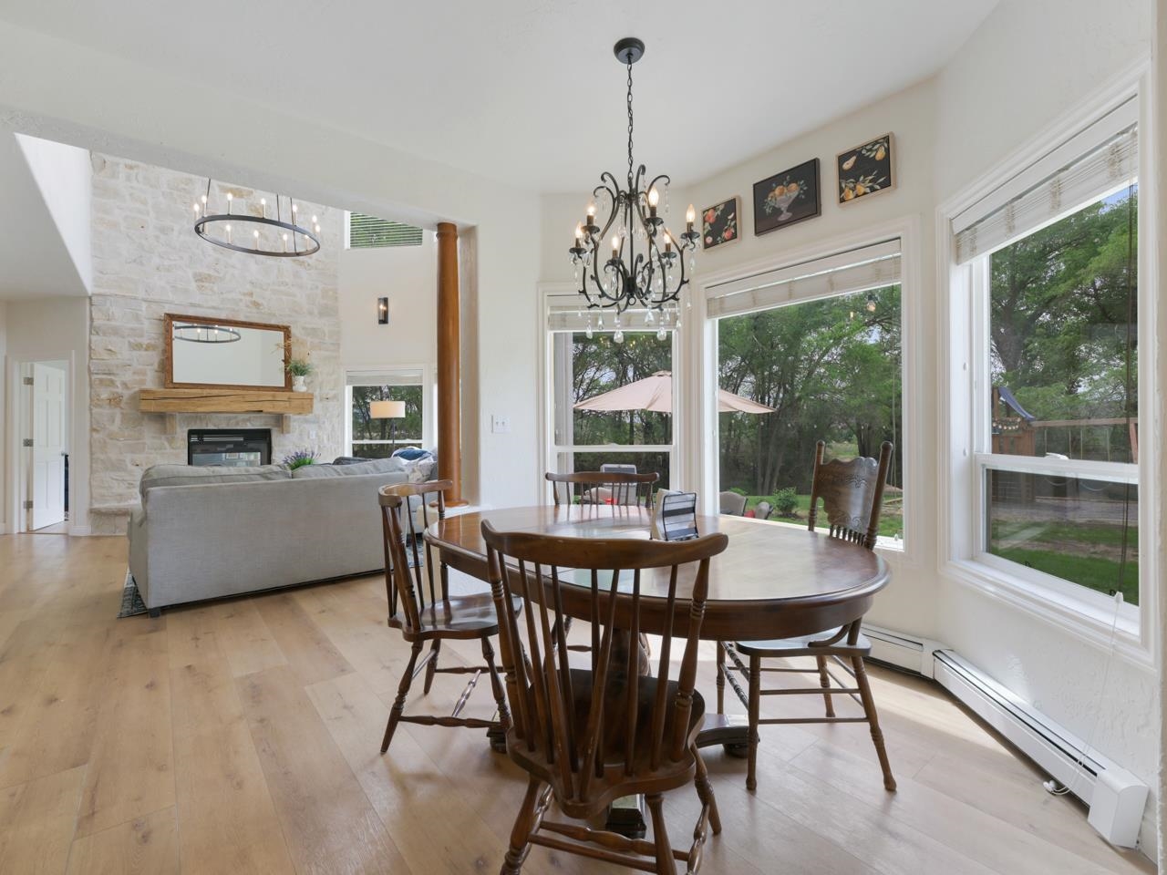 2433 H Road Grand Junction, CO 81505 - Photo 12 of 42 a view of a dining room with furniture large windows and wooden floor