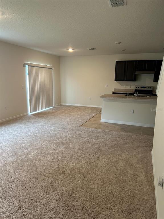 814 Sun Burst Road Winter Haven, FL 33880 - Photo 2 of 48 a view of a livingroom with a flat screen tv