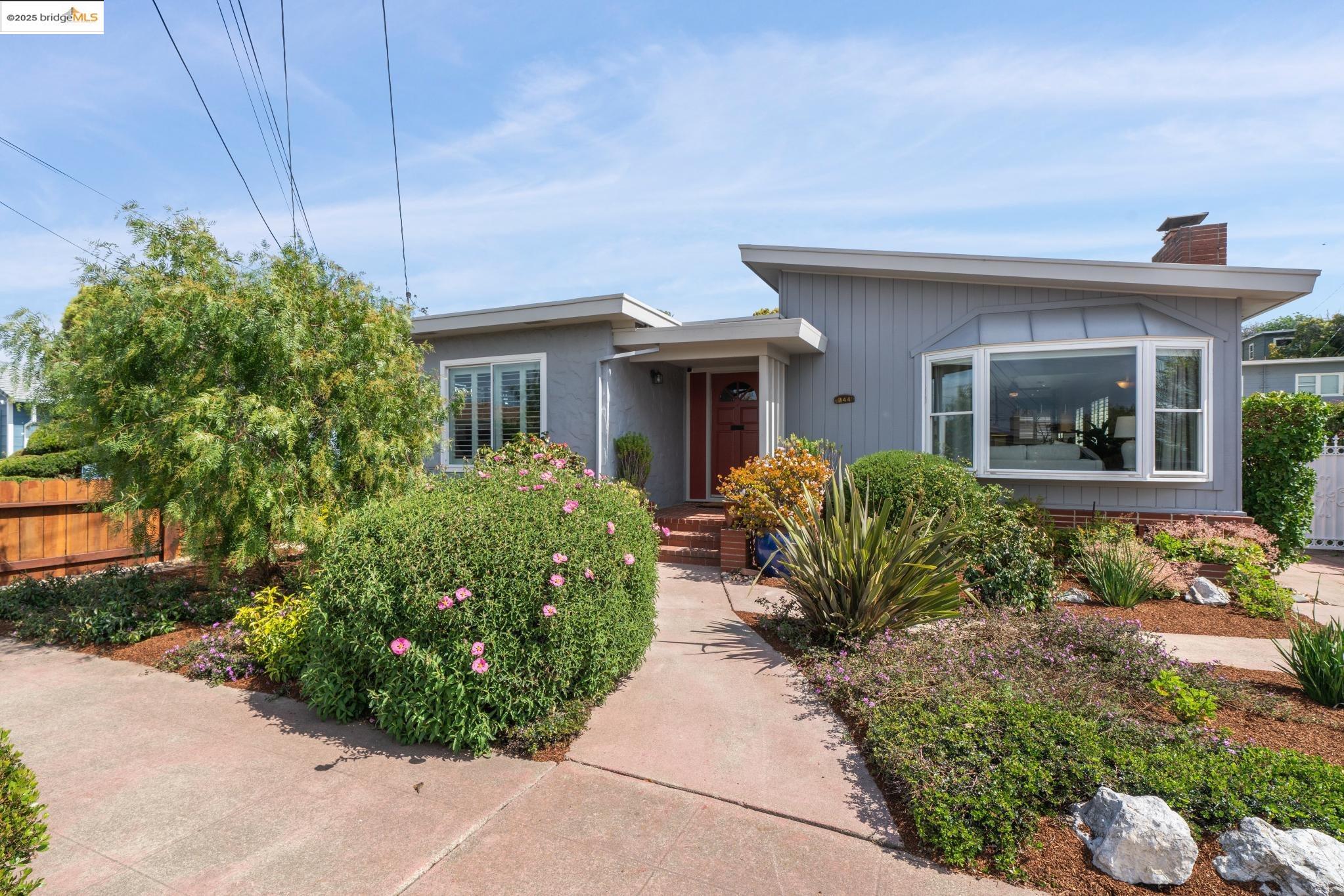 744 35th Street Richmond, CA 94805 - Photo 1 of 1 front view of a house with a garden