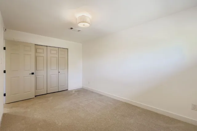 a view of a backyard with green space