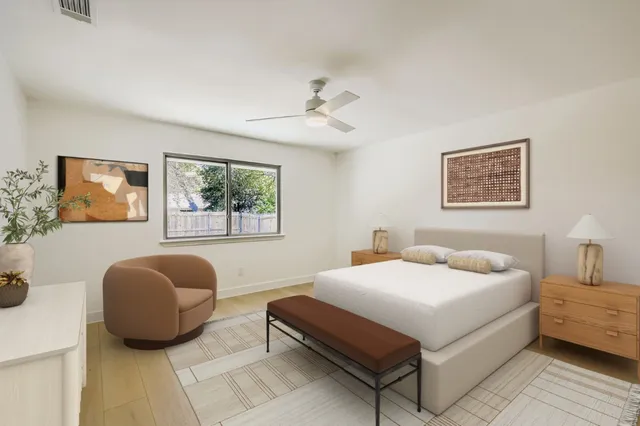 a bedroom with a bed and window