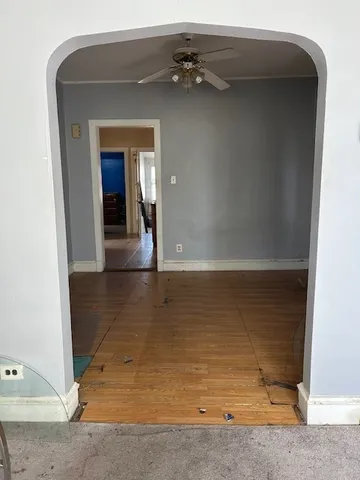 an empty room with wooden floor