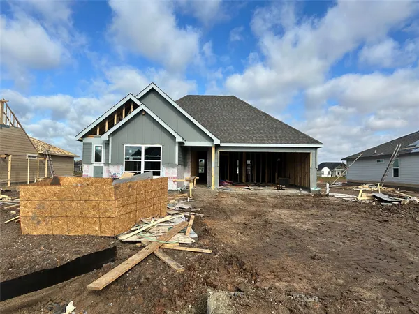 a view of house with wooden fence