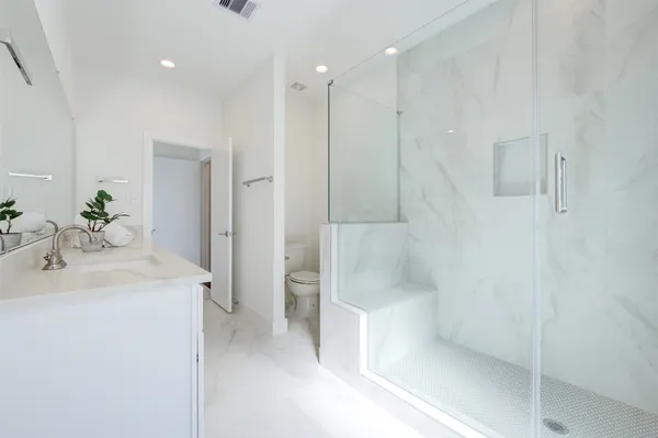 a bathroom with double sink and a mirror