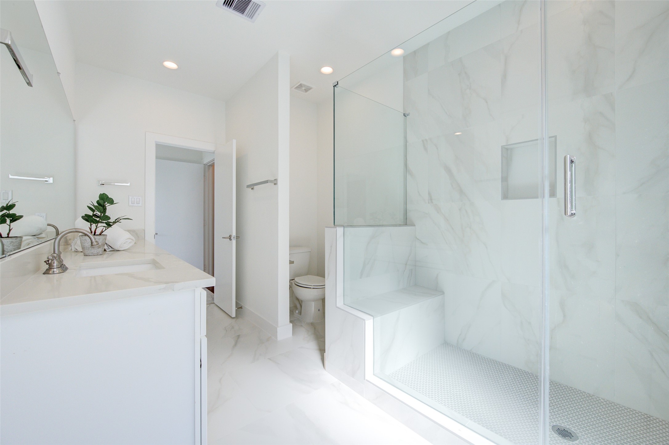 853 Mansfield Street, Unit A Houston, TX 77091 - Photo 13 of 16 a bathroom with a sink a mirror and a shower