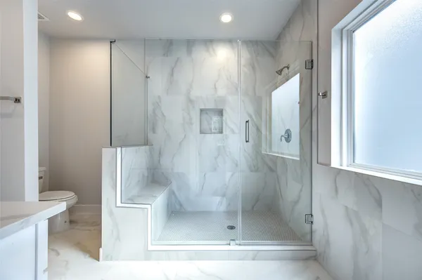 a bathroom with a sink a mirror and a shower