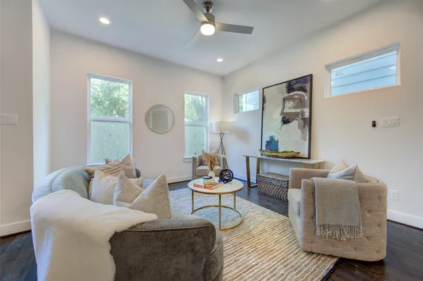 a dining room with furniture and wooden floor