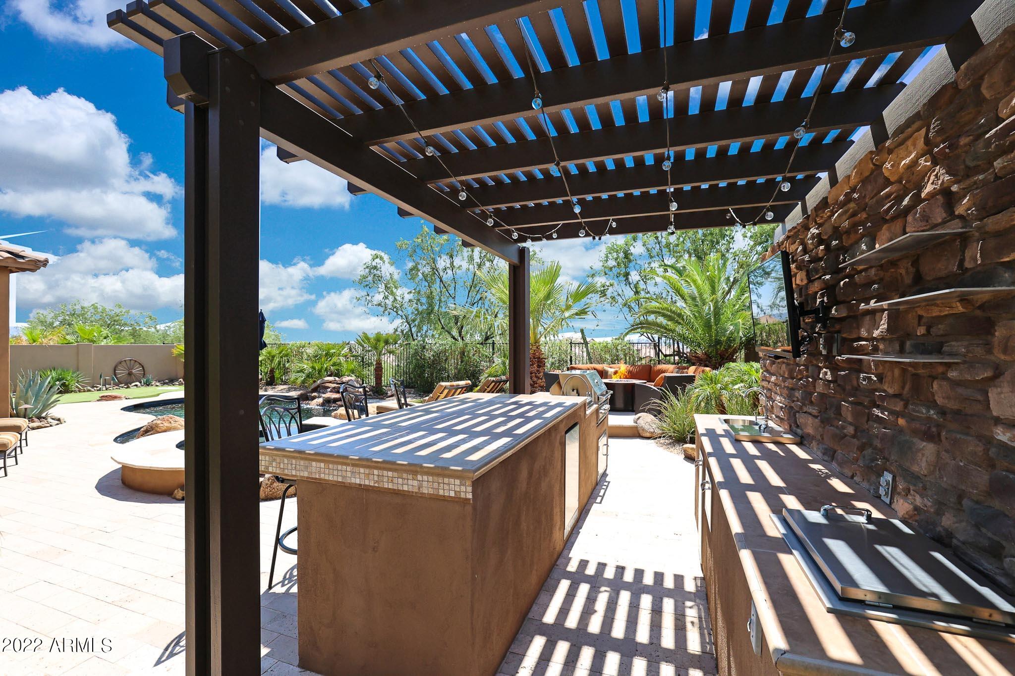 18333 West Desert Trumpet Road Goodyear, AZ 85338 - Photo 54 of 124 Pergola over the outdoor kitchen