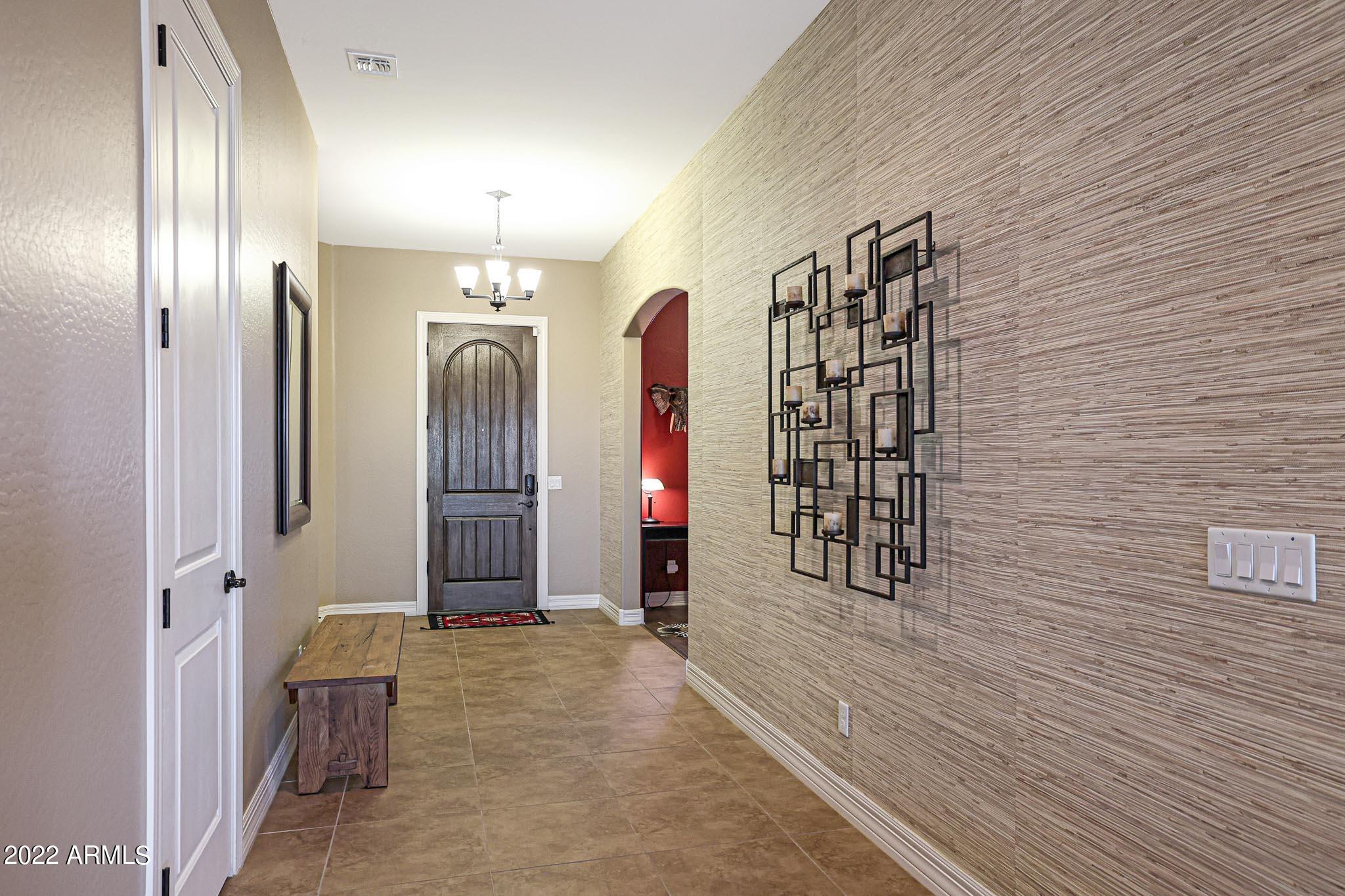 18333 West Desert Trumpet Road Goodyear, AZ 85338 - Photo 8 of 124 Grass Cloth feature in the entryway