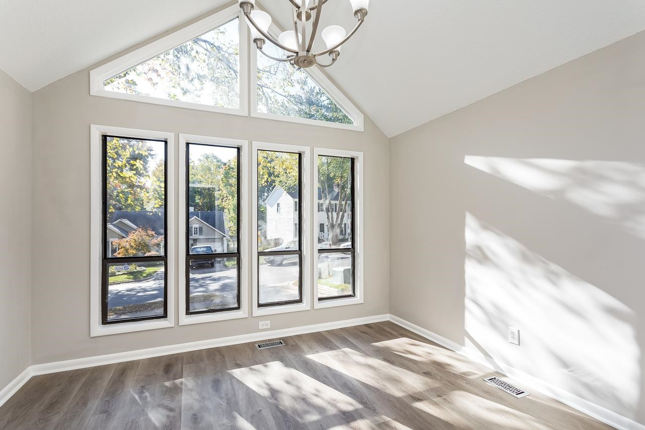 2809 Hiking Trail Raleigh, NC 27615 - Photo 8 of 28 This sunny separate dining room with soaring windows has many options...dining room, playroom, home office...you decide!! Dining Room