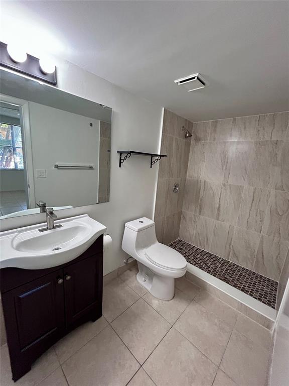 4481 West McNab Road, Unit 26 Pompano Beach, FL 33069 - Photo 12 of 13 a bathroom with a sink a toilet and shower