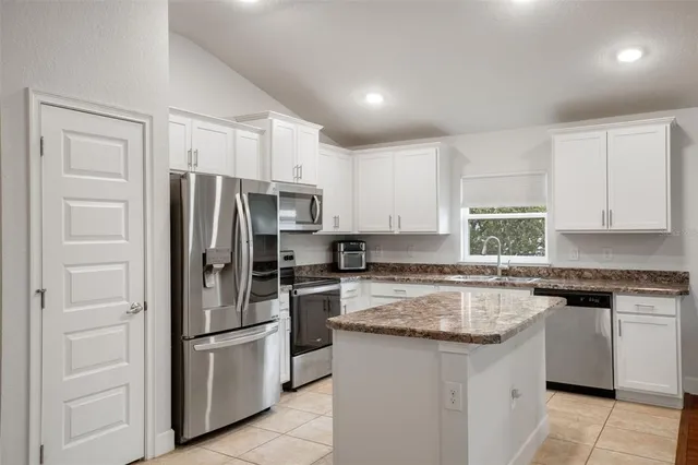 a view of living room kitchen and hall