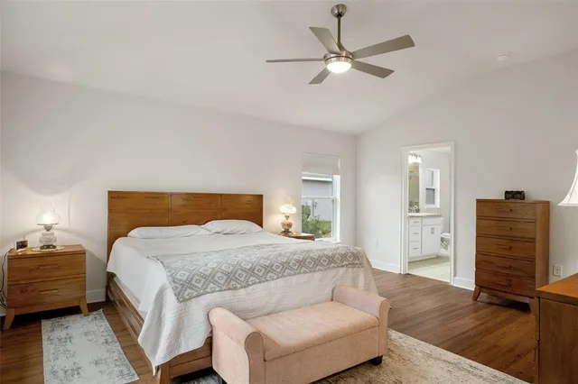 a bedroom with a bed and a dresser