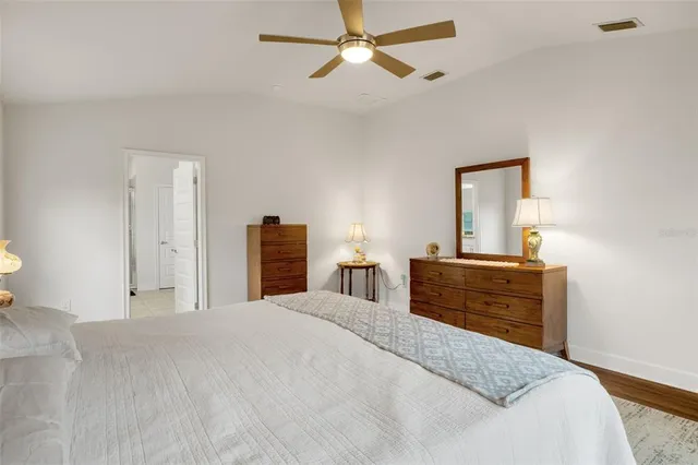 a bathroom with a double vanity sink toilet and shower