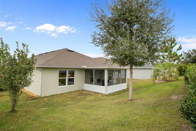 a view of a lake with a yard