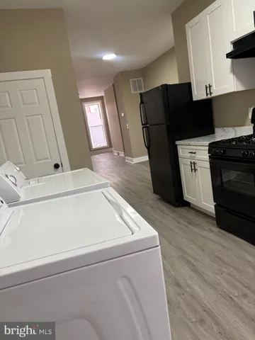 a utility room with washer and dryer