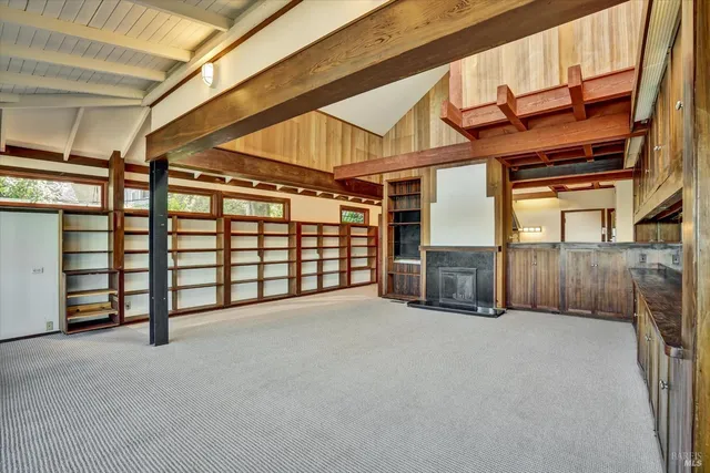 a view of an empty room with windows