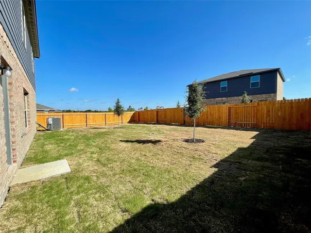 a view of swimming pool with a yard