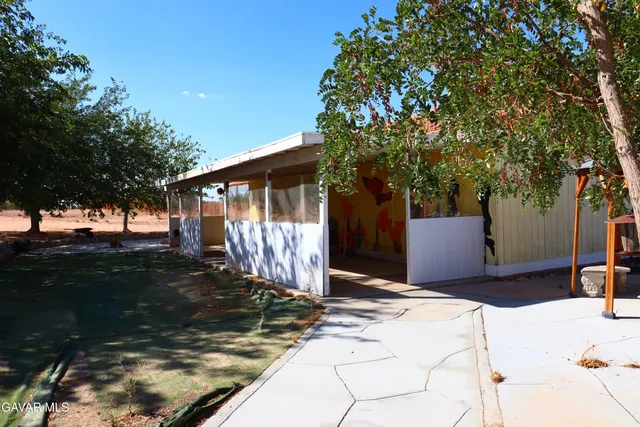 a view of a building with sitting area