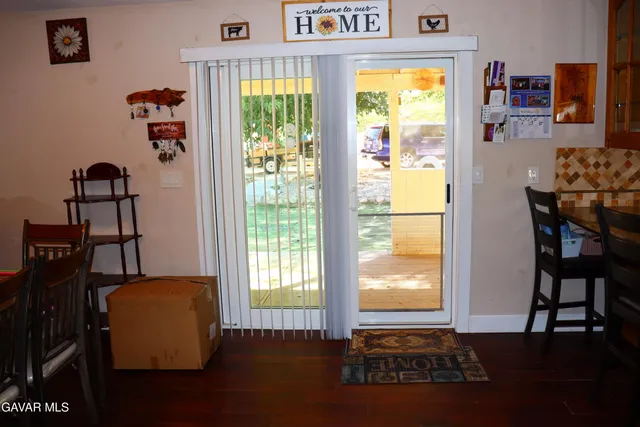 a kitchen that has a table and chairs in it