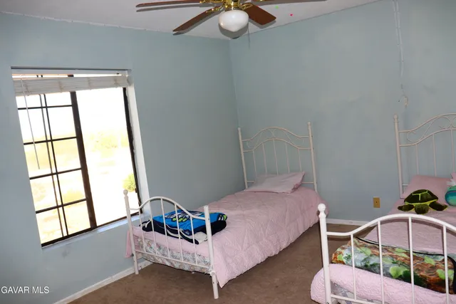 a bathroom with a toilet a sink and a mirror