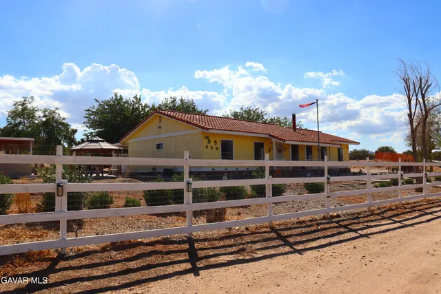 a front view of a house with patio