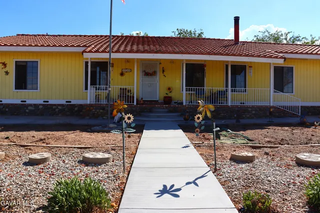 a view of a house with a street