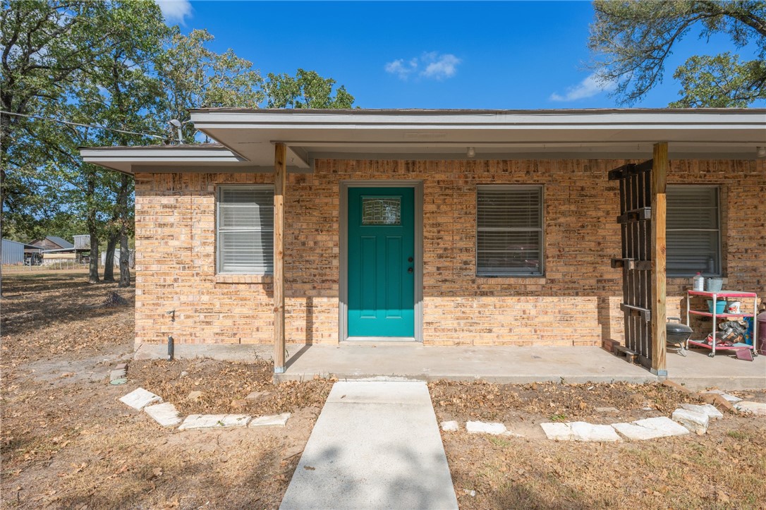 4950 Schehin Road College Station, TX 77845 - Photo 2 of 13 a view of a brick house with a large windows