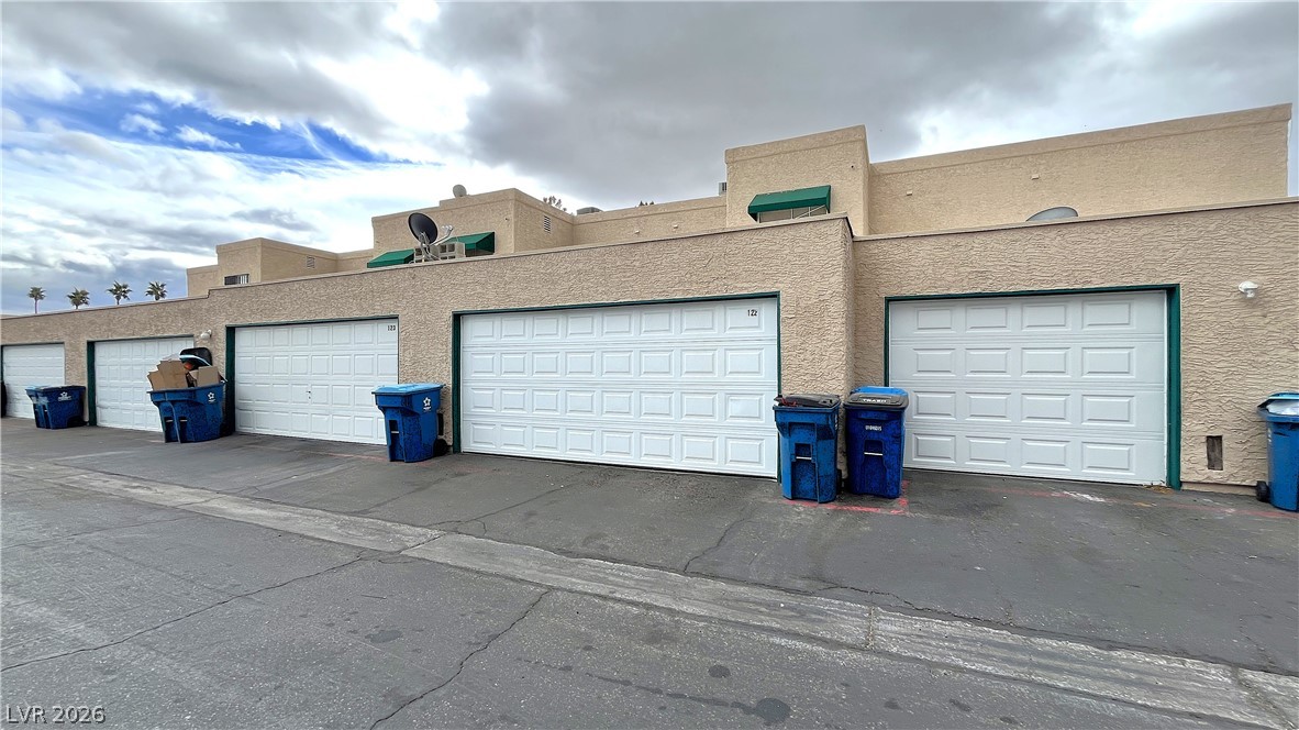 6750 Del Rey Avenue, Unit 123 Las Vegas, NV 89146 - Photo 19 of 21 Attached garage parking is available at this multi-unit complex.