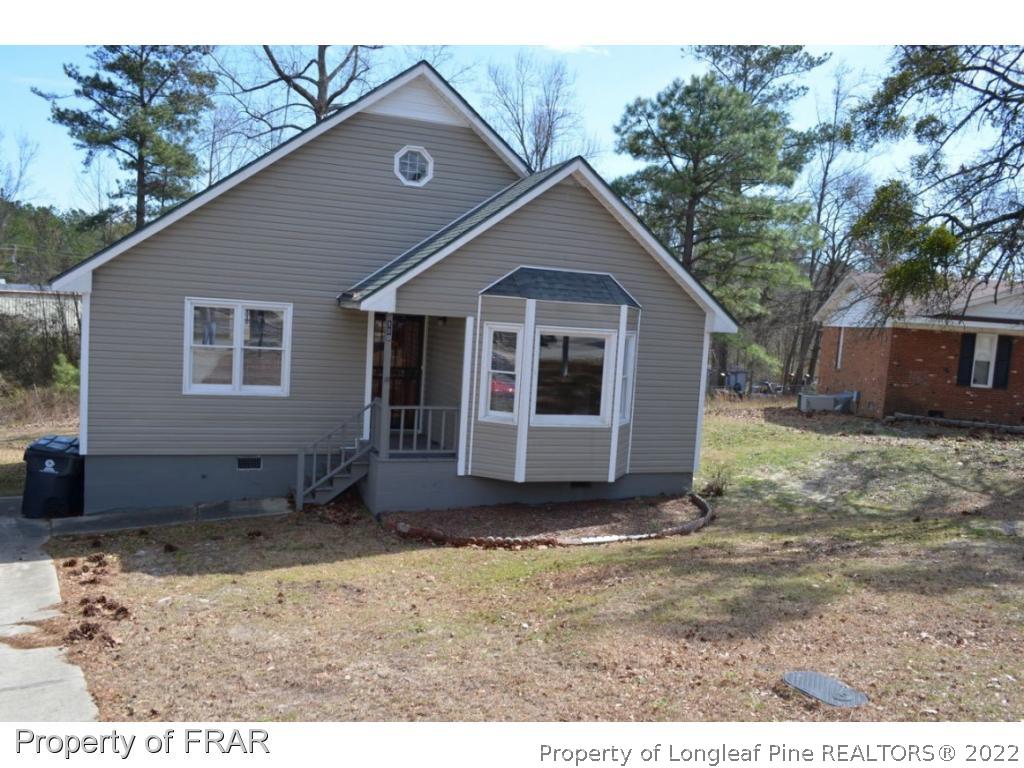 110 Bruce Lane Spring Lake, NC 28390 - Photo 1 of 21 a view of a house with a yard